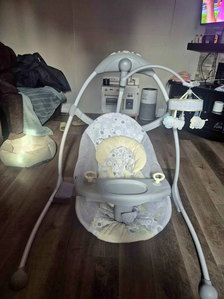 Baby swing with mobile