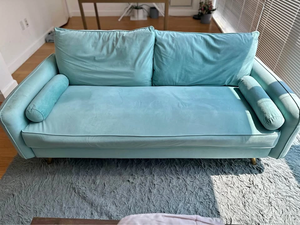 Light green / teal sofa with cushion back, arm rest, seat cushio