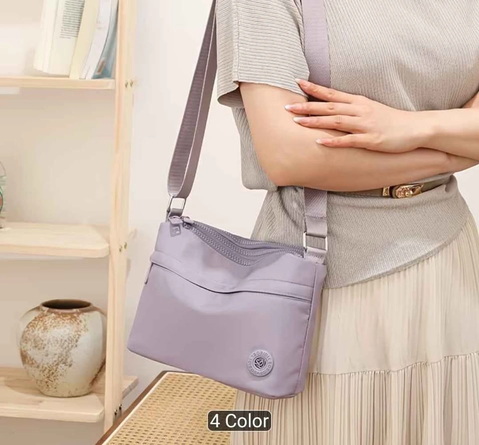 Brand new premium nylon multi pocket light weight crossbody bag - photo 2