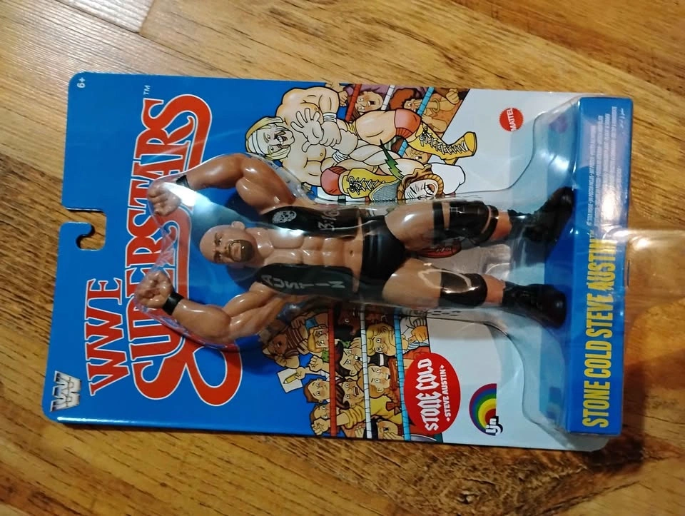 Stone Cold action figure, tin signs, and 90s belts - photo 2