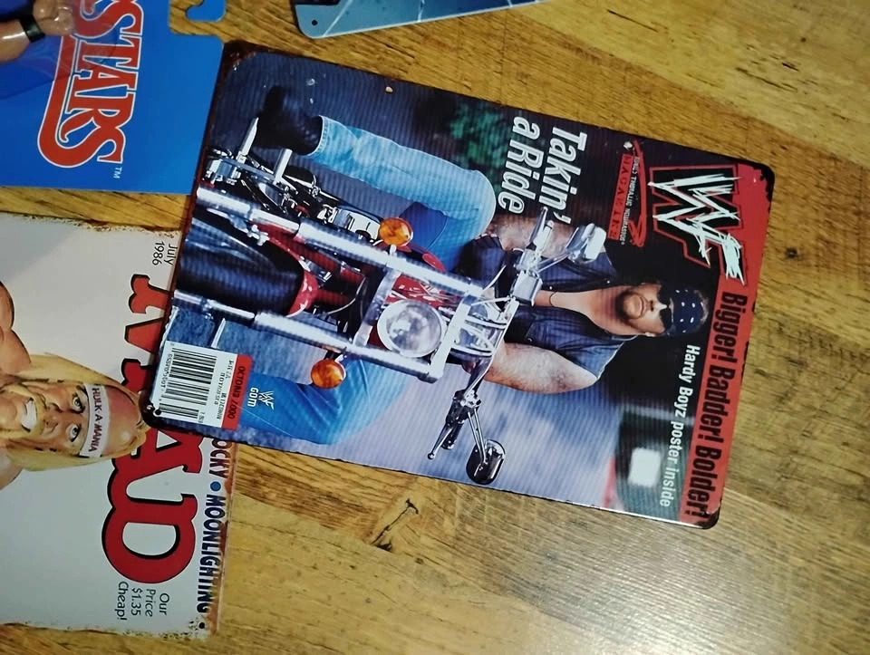 Stone Cold action figure, tin signs, and 90s belts - photo 4