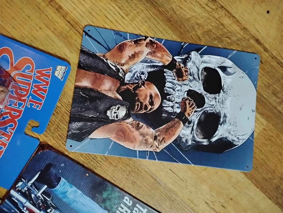 Stone Cold action figure, tin signs, and 90s belts - photo 5