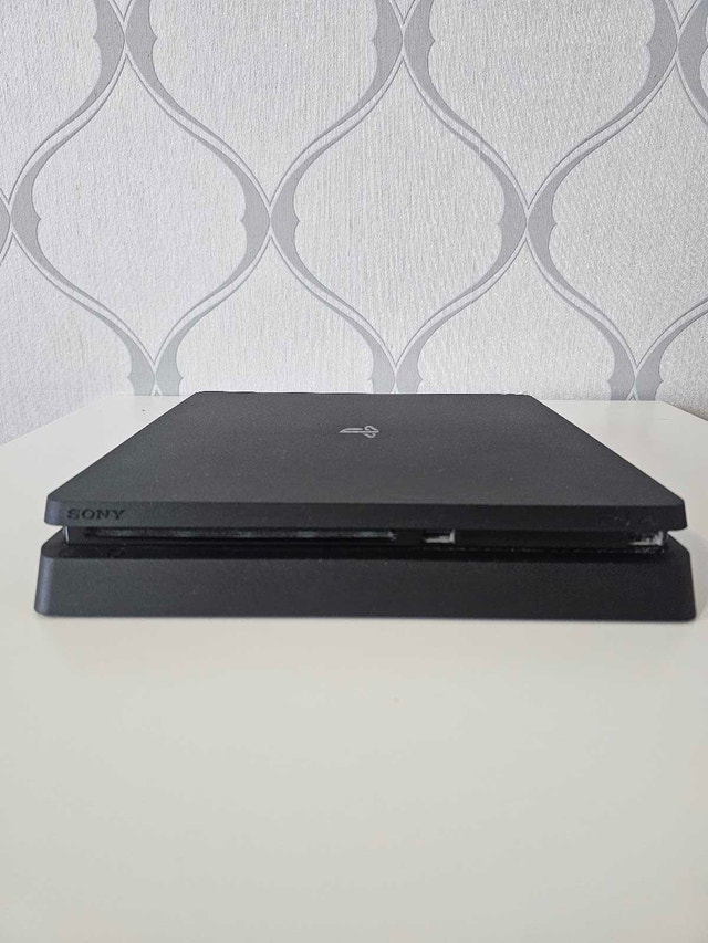 PS4 Console + 2 Controllers + 10 Games – Works, As-Is
