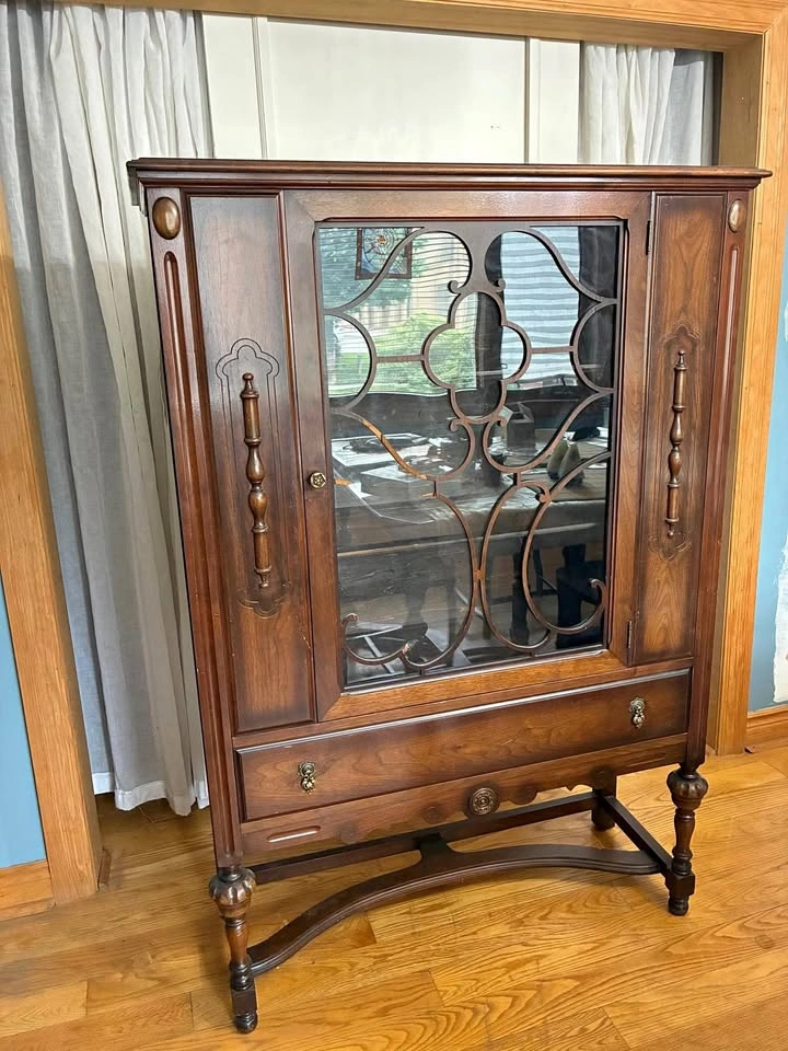 Antique dining room cabinet with glass door