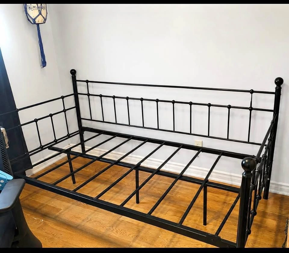 Black Metal Daybed Frame with mattress and sheets