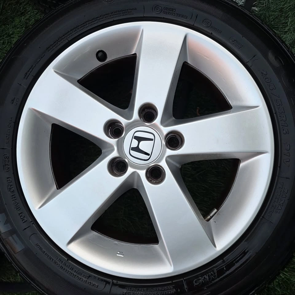 205/55/16 All Season Tires 80% Tread with Honda Alloy Rims - photo 2