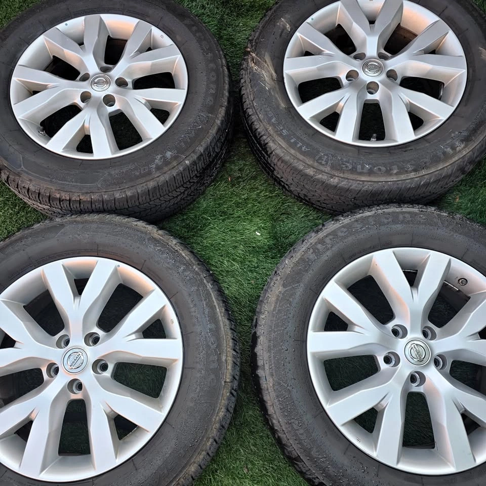 235/65/18 Firestone All Season Tires with Nissan OEM Rims