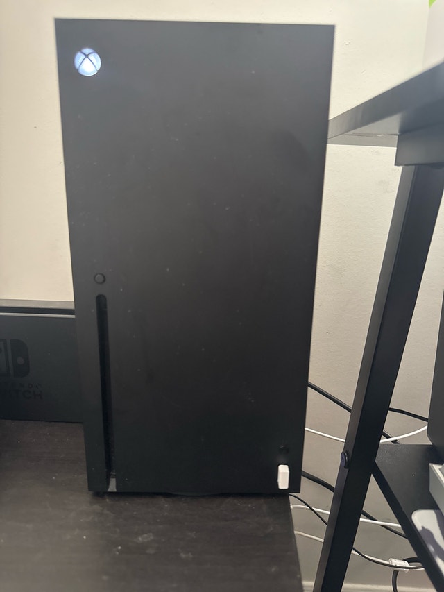 Xbox Series X with two controllers
