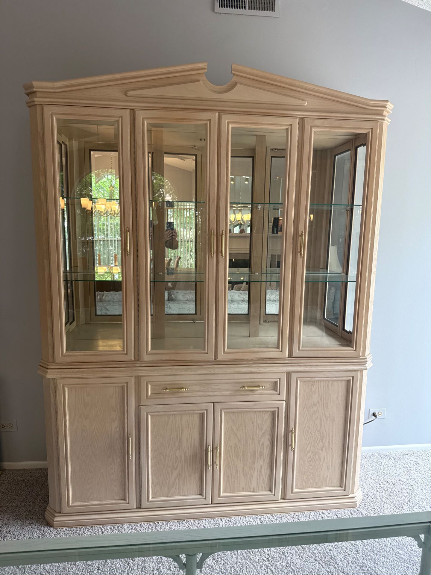 Wooden and glass china cabinet with mirror back