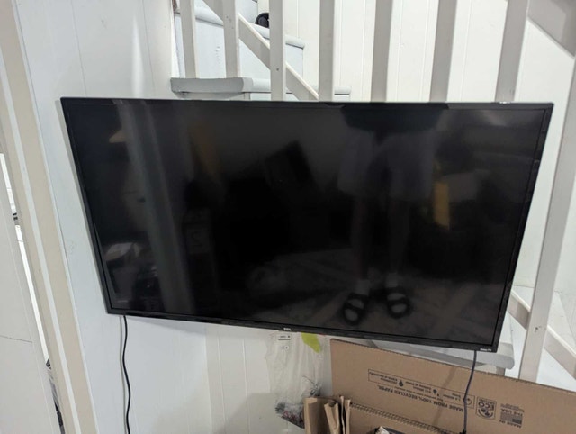 TCL 40-inch Smart LED TV with mounting bracket and feet