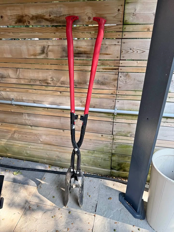 Fence and Decks: Red and black post hole digger