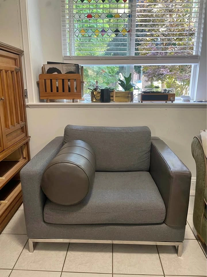 Chair with leather armrest cover and pillow