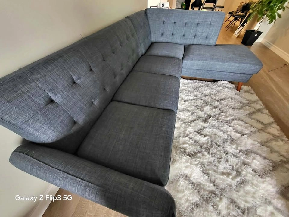 Sofa for sale with free pillows. Available immediately!