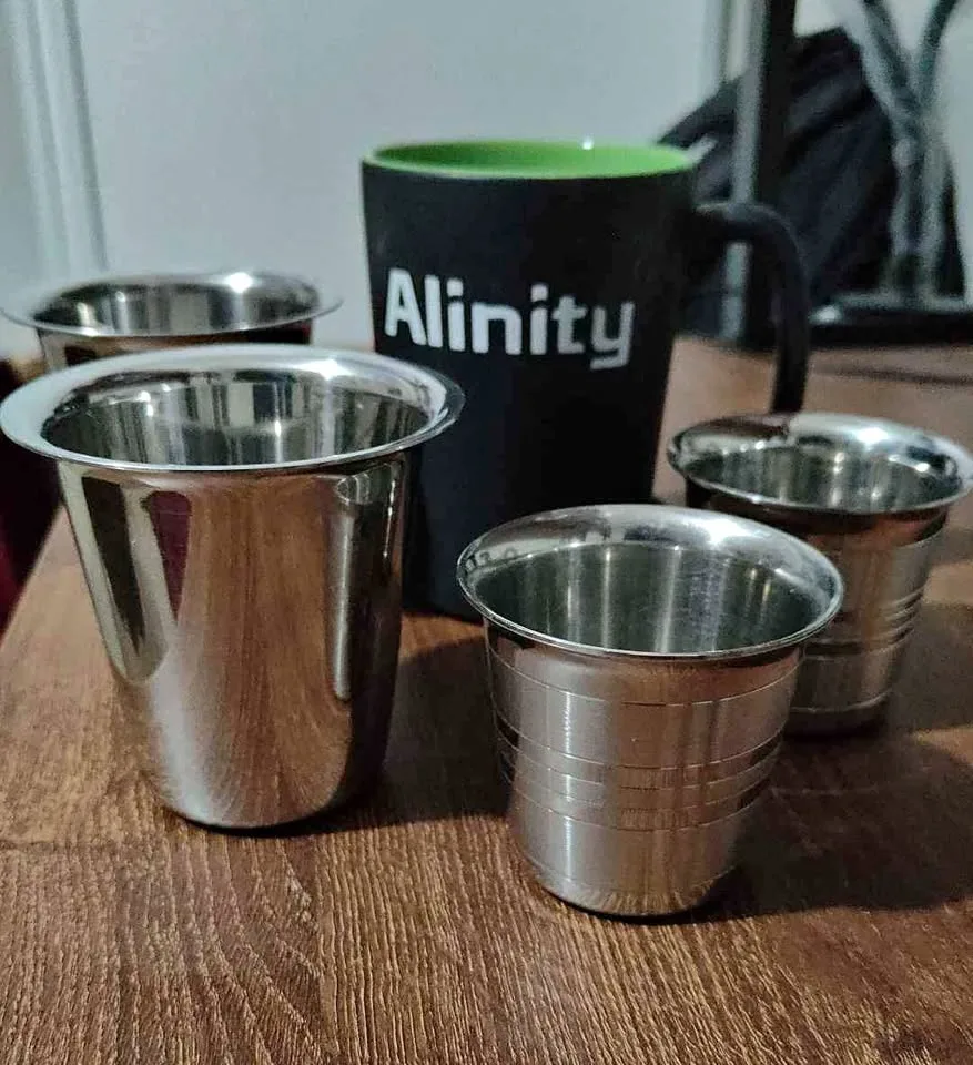 Kitchen utensils - 4 stainless steel cups and 1 coffee mug thumbnail