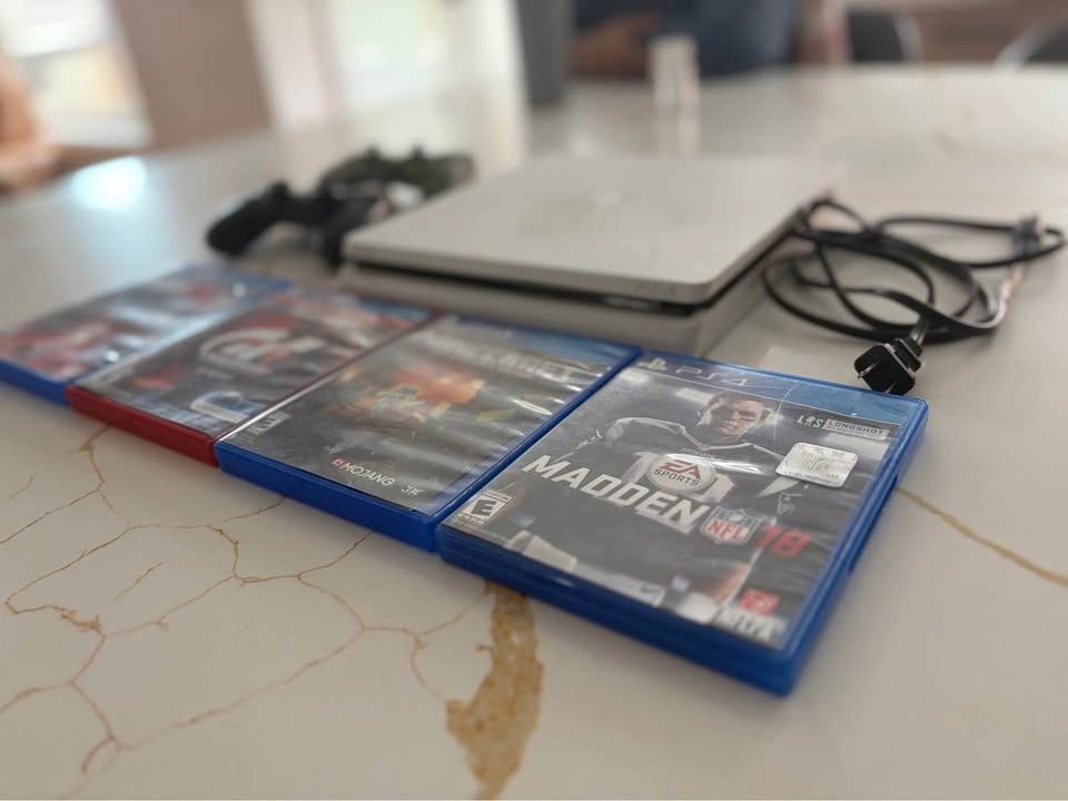PS4 Slim 1TB Glacier White with 2 Controllers and 4 Games