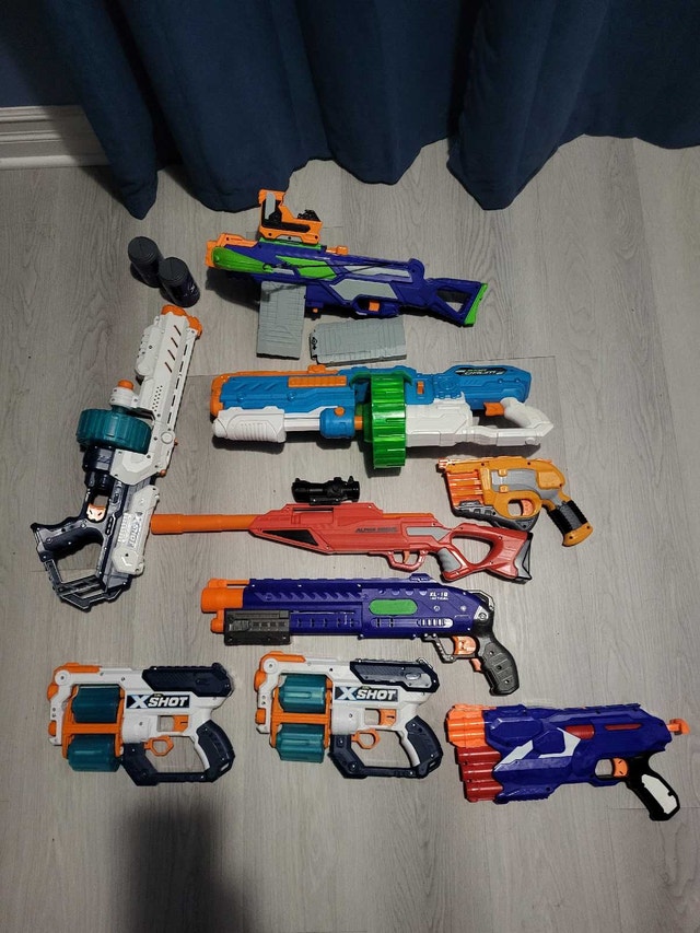 9 Assorted Nerf Blasters and X-Shot Guns