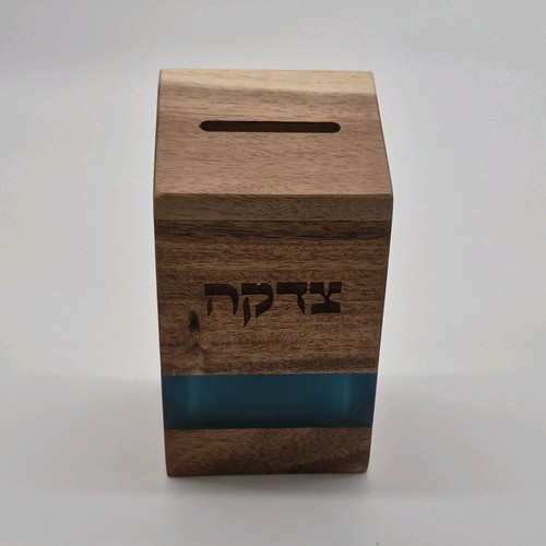 Wooden Tzedakah box with blue accent and Hebrew inscription