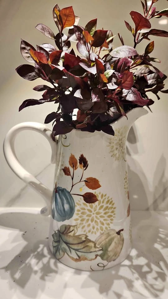 Upcycled water jug planter with plant