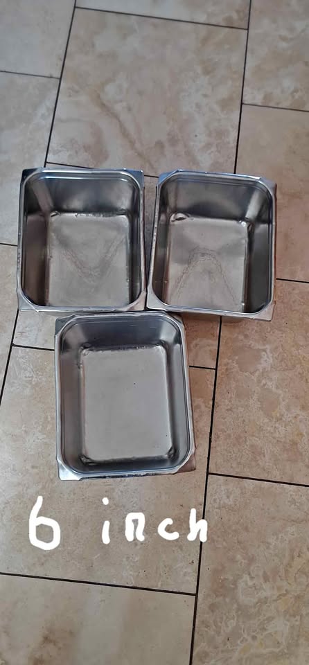 Stainless steel steam table inserts and lids.