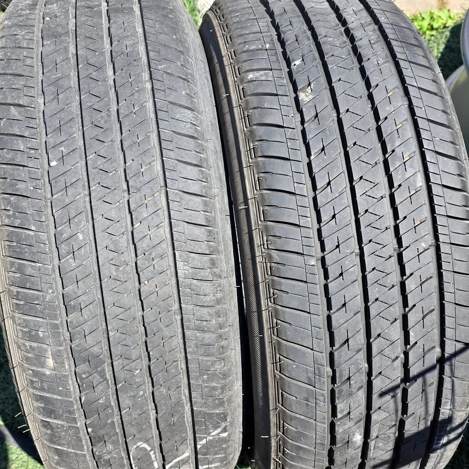 two 215/55/17 bridgestone all season tires 85% tread