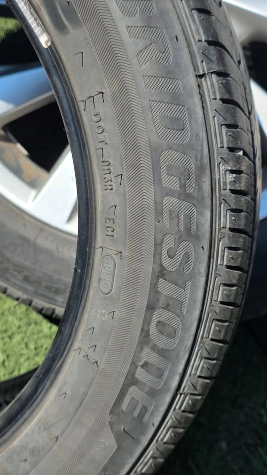 two 215/55/17 bridgestone all season tires 85% tread - photo 2