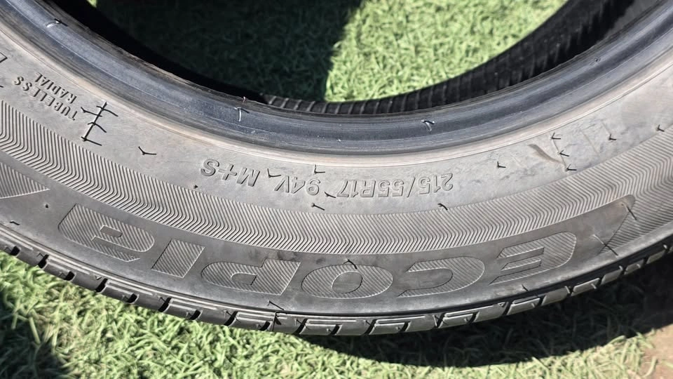 two 215/55/17 bridgestone all season tires 85% tread - photo 3