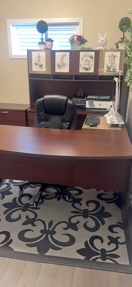 Spacious brown office desk with hutch, keyboard tray, and drawer