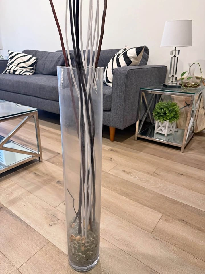 Glass vase with wooden sticks