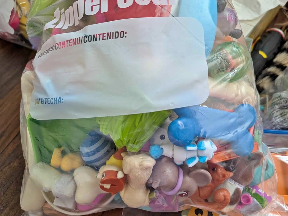 Multiple bags of mini toys figures