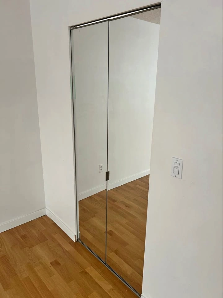 frameless bi-fold mirrored closet door