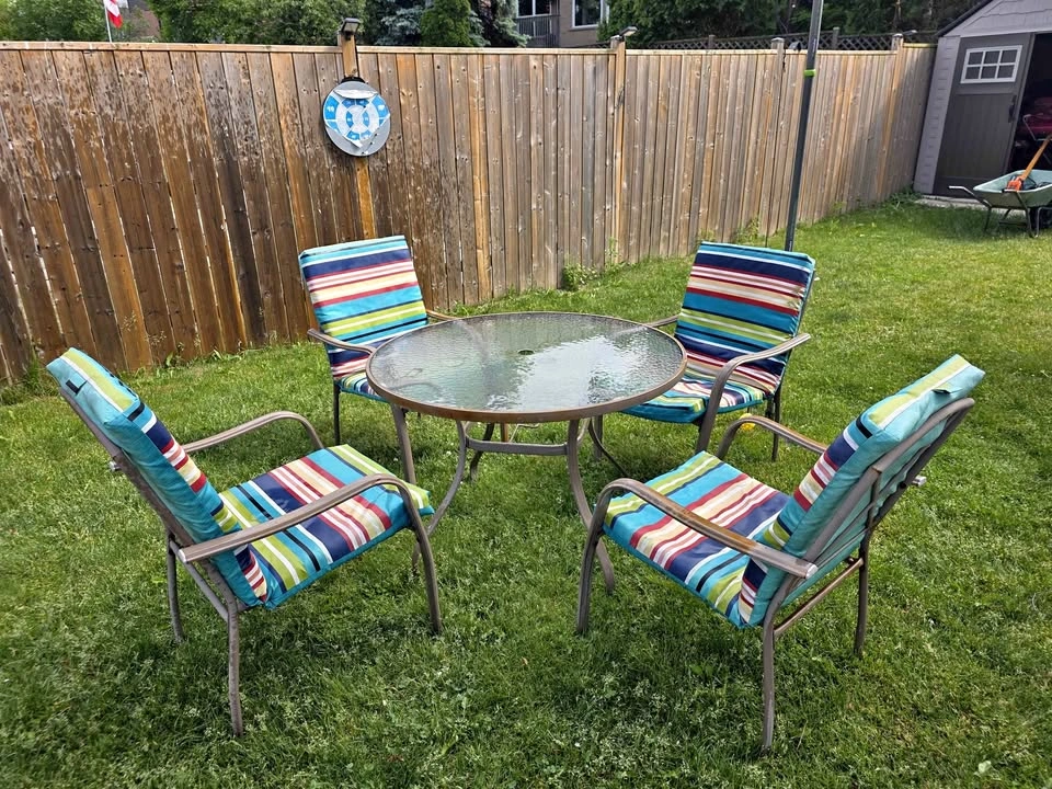 Patio set with glass table and 4 chairs