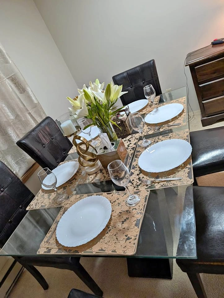Glass Top Dining Table with 6 Black Chairs