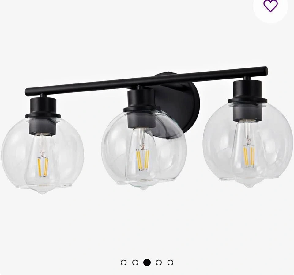 Black 3 light vanity light with frosted glass globe shades