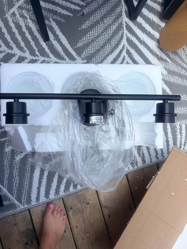Black 3 light vanity light with frosted glass globe shades - photo 2