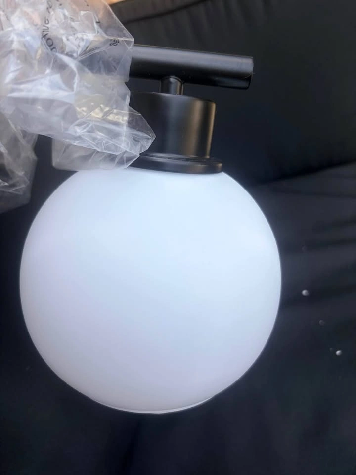 Black 3 light vanity light with frosted glass globe shades - photo 3