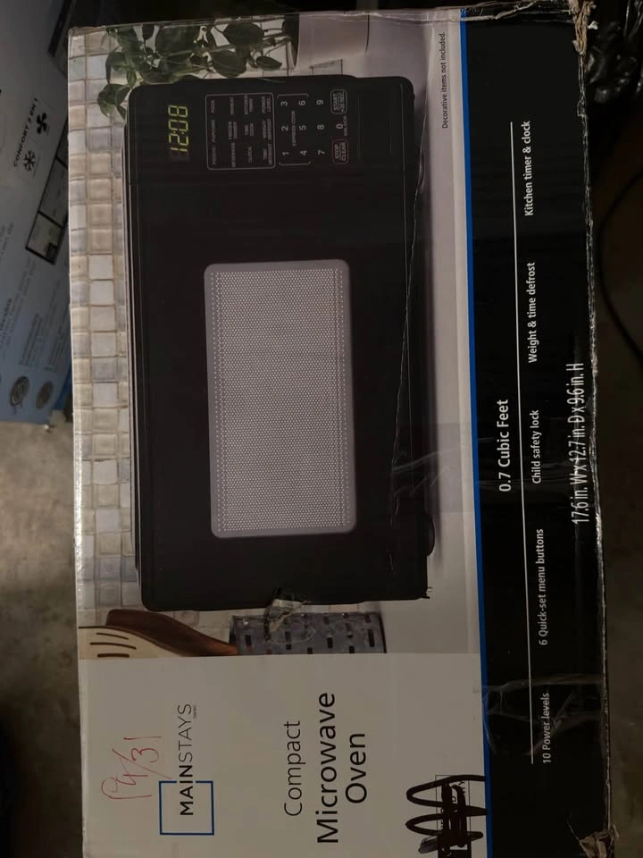 Mainstays 0.7 Cu ft Countertop Microwave Oven, 700 Watts - photo 2