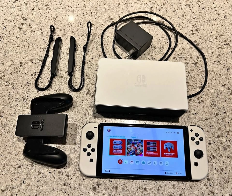Nintendo Switch OLED System Bundle in Mint Condition