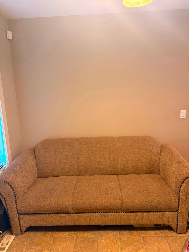 MOVING SALE! Tan Textured Three-Seat Sofa
