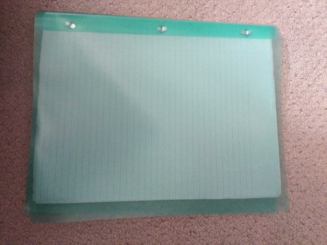 Two plastic report covers filled with paper