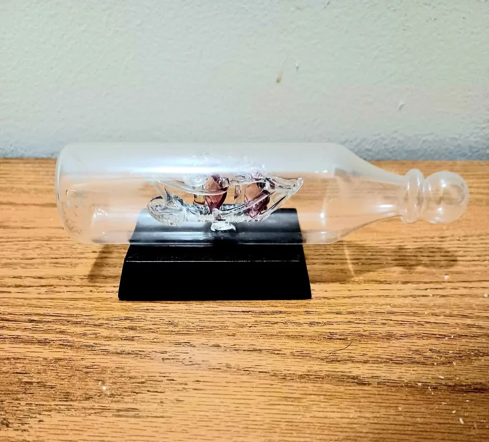 Handmade Cranberry Glass Sailship Inside a Bottle thumbnail
