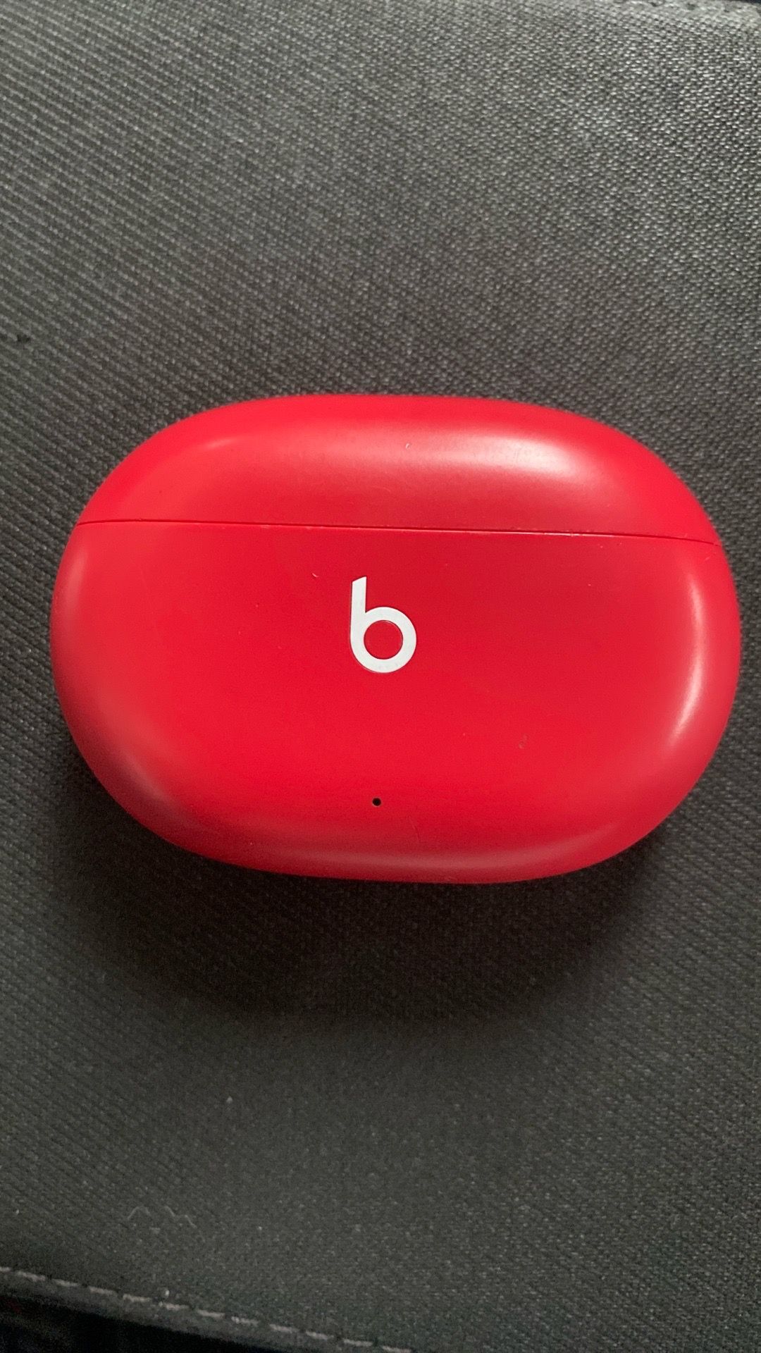 Beats Studio Buds in the "Beats Red" colorway.