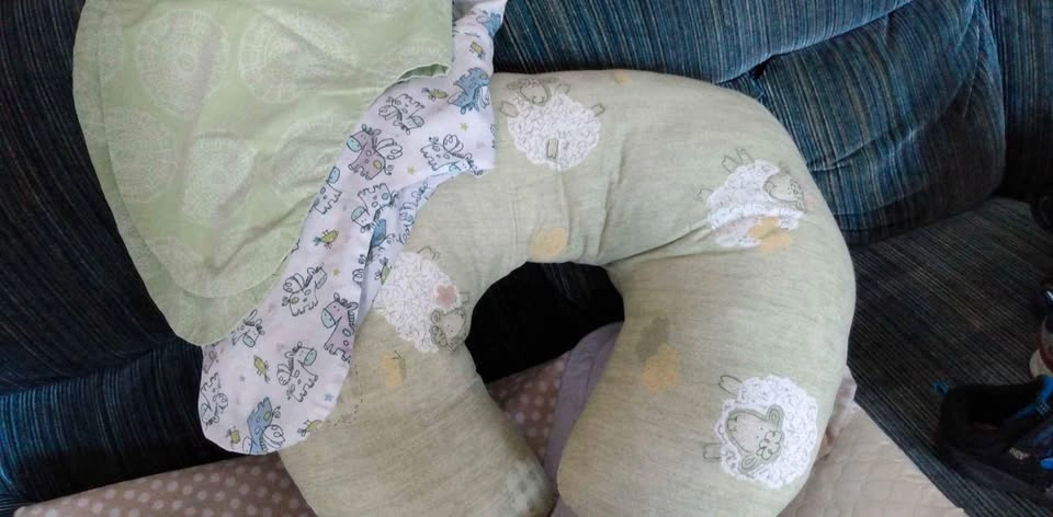 Nursing pillow with 2 covers