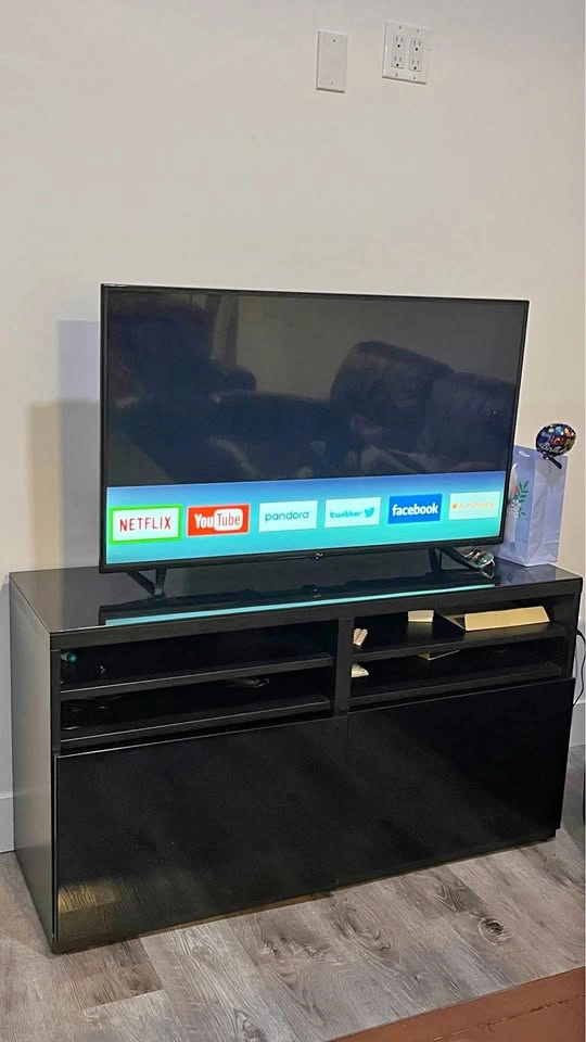 TV with stand, standing mirror, and French coffee press