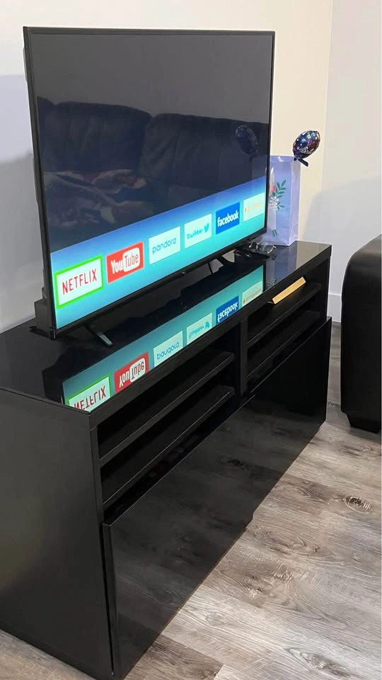 TV with stand, standing mirror, and French coffee press - photo 2