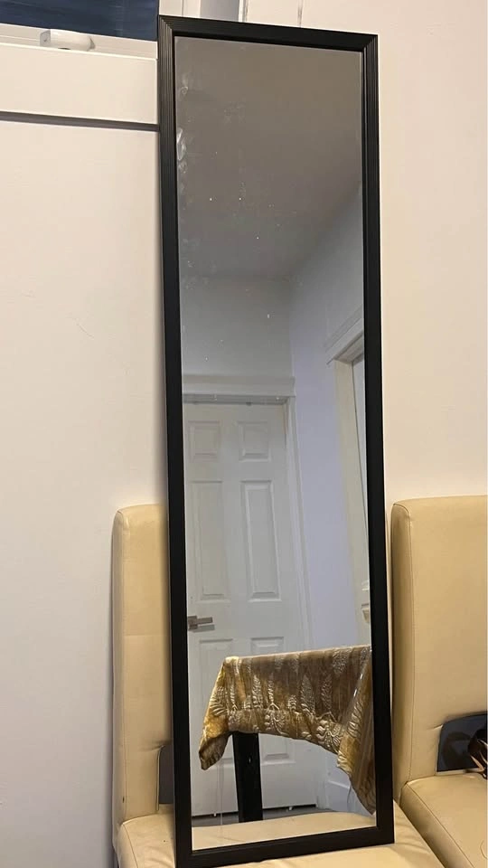 TV with stand, standing mirror, and French coffee press - photo 3