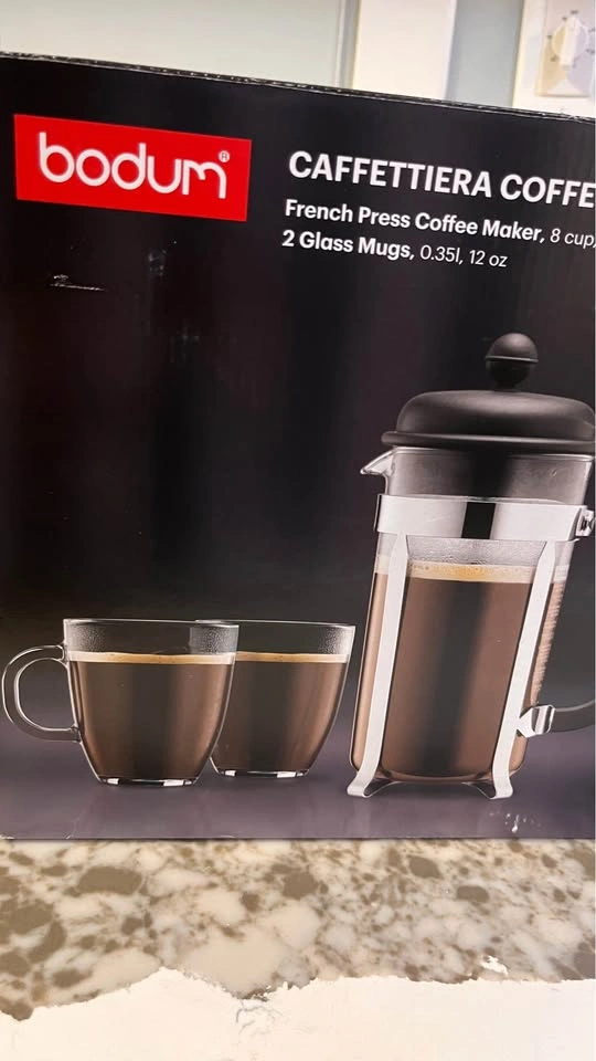 TV with stand, standing mirror, and French coffee press - photo 4