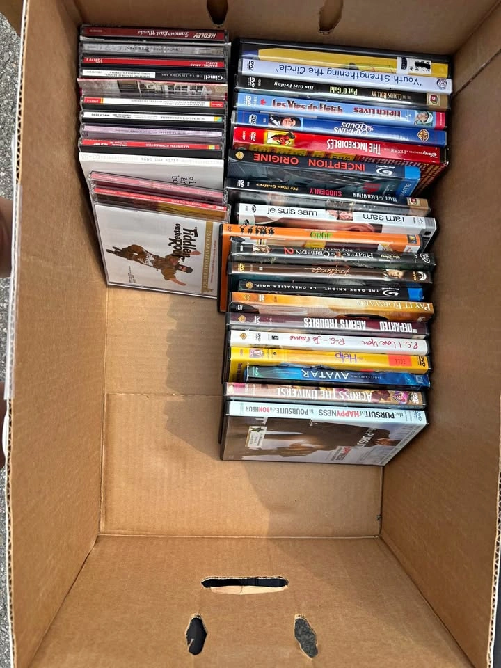 Box of DVDs and CDs
