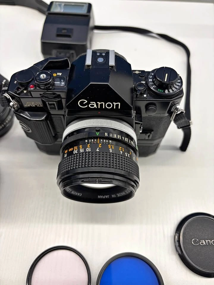 Canon A1 film camera with 3 different lenses