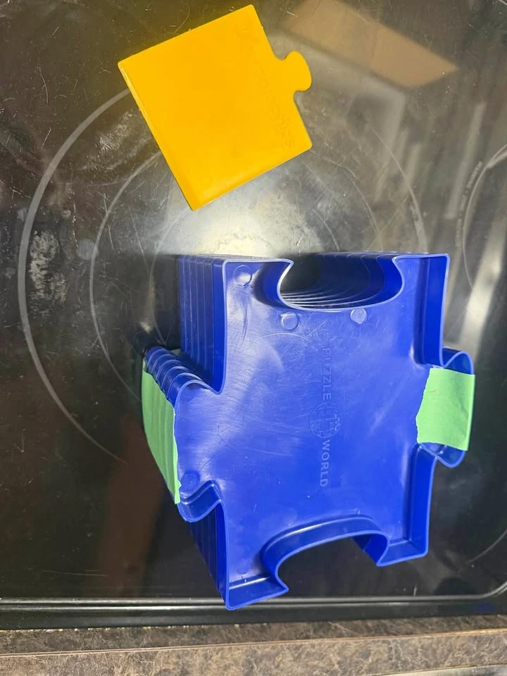 Puzzles sorter and glue spreader