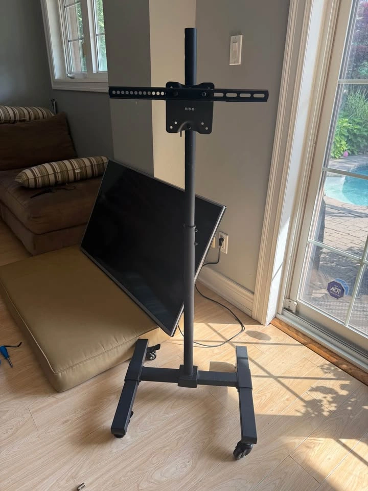 LG 49” Smart LED TV + VIVO Rolling TV Stand - photo 2